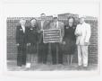 Primary view of [Group Holding Plaque in Front of Wall]