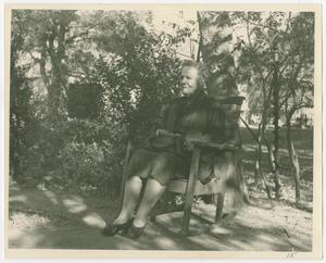 Primary view of object titled '[Woman in Chair Outside Facing Left]'.