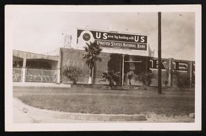 Primary view of object titled '[Postcard of a United States National Bank Billboard]'.