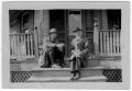 Primary view of [Two Unidentified Men Sitting on a Porch]