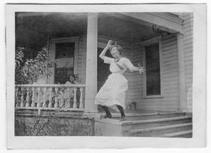 [Unidentified Girl Standing on a Baluster]