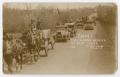 Postcard: [Postcard of a Carriage and Cars]