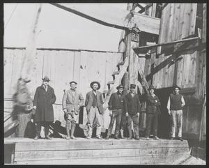 Primary view of object titled '[Men Standing on an Oil Rig]'.