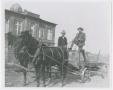 Photograph: [Two Men on a Carriage]