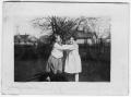 Photograph: Two Girls Playing in Yard