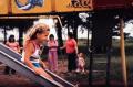 Thumbnail image of item number 1 in: '[Girl on a Slide at North Lakes Park]'.