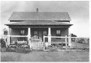 [One story wood house with front porch]