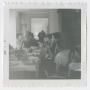 Photograph: Unidentified people seated at a table