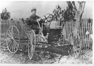 [Early model chain drive automobile]
