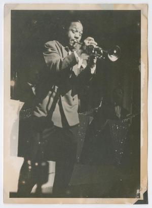 Roy Eldridge in front of saxophone section