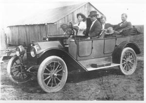 [Four unidentified men in a 1913 Buick]