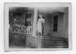 [Unidentified Girl Standing on a Baluster]