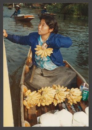 [Woman in Boat with Bananas]