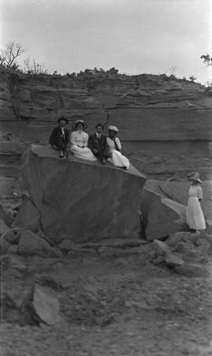 [Mathew Palm and Family on Rock]