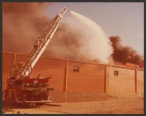 [Side view of a building in flames]