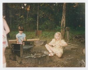 Primary view of object titled '[Children Sitting Next to a Campfire]'.