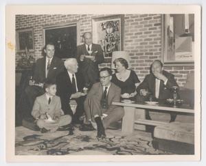 [Photograph of Helen Corbitt having dinner with men]