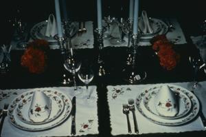[Formal place setting with candles]