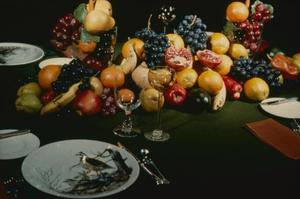[Formal place setting with fruit]