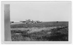 Primary view of object titled '[Airplanes at a small airport]'.