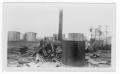 Photograph: [Debris near the storage tanks after the 1947 Texas City Disaster]