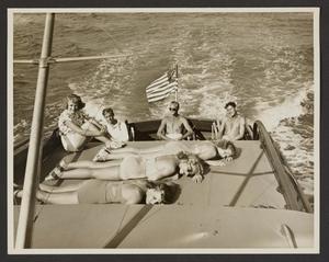 [Men and Women Sun Bathing on Boat]