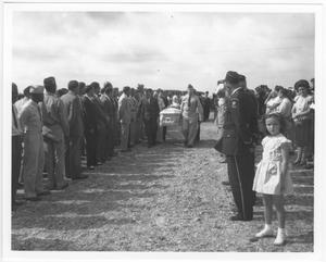 [An honor guard carries in a coffin at the mass funeral service for victims of the 1947 Texas City Disaster]
