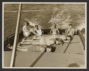 [Men and Women Sun Bathing on Boat #3]