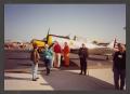 Photograph: [Group of People Next to WWII-Era Plane]