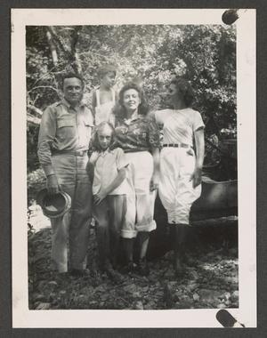 [Two Women, Man, and Two Children]