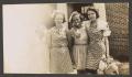 Photograph: [Four Young Women in Front of a Building]