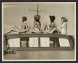 Photograph: [Women Posed on top of Boat Cabin]