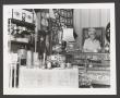 Photograph: [Charlyne Creger in a Shop]