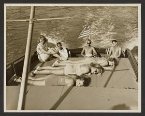 [Men and Women Sun Bathing on Boat #2]