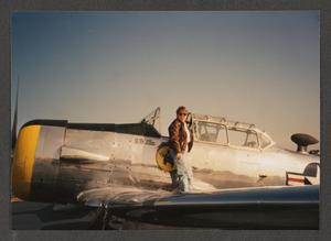[Woman on Wing of WWII-Era Plane]