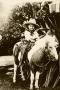Photograph: [Young Cowboy on Horseback]