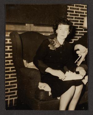 [Woman with Corsage Seated in Chair]