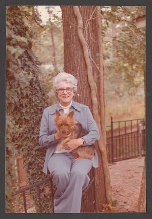 Primary view of object titled '[Charlyne Creger Holding a Dog]'.