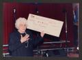 Primary view of [Charlyne Creger Holding an Oversized Check]