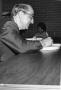 Primary view of [Walter Rundell Signing a Book]