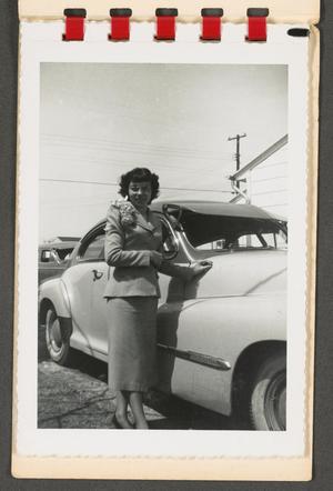 [Woman with Corsage Standing with Car]