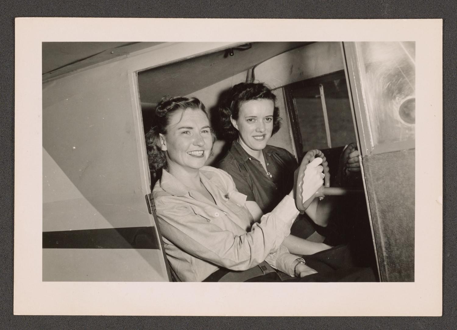 [2 Smiling Women in Plane Cockpit]
                                                
                                                    [Sequence #]: 1 of 2
                                                