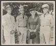 Photograph: [Man and Woman with Two Uniformed Men]