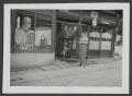 Photograph: [Marjorie Wakeham Outside a Storefront]