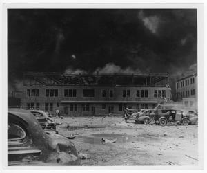 [Damaged automobiles and building after the 1947 Texas City Disaster]
