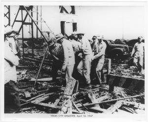 [Rescue workers recover a body from the 1947 Texas City Disaster]