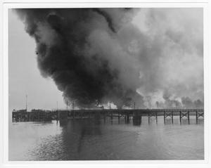 [Burning storage tanks near the port after the 1947 Texas City Disaster]