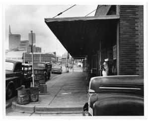 Primary view of object titled '[Prestonwood Hotel and Rainbow Poultry & Eggs Storefront]'.