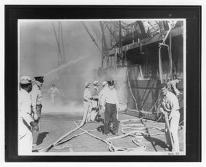 [Fighting fires on board ship during the 1947 Texas City Disaster]