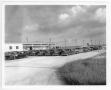 Photograph: [Hearses waiting to be used after the 1947 Texas City Disaster]
